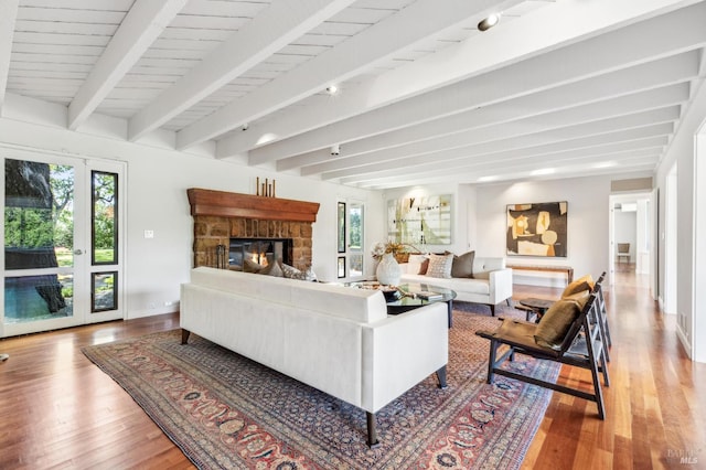 5768 Silverado Trl, Napa, CA 94558 - living area with wood finished floors, beam ceiling, a fireplace, and baseboards