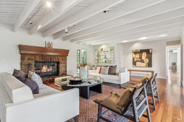 5768 Silverado Trl, Napa, CA 94558 - living area with wood finished floors, rail lighting, a fireplace, beam ceiling, and baseboards