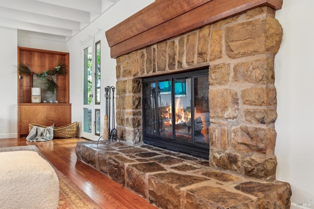 5768 Silverado Trl, Napa, CA 94558 - detailed view of a stone fireplace, wood finished floors, and baseboards