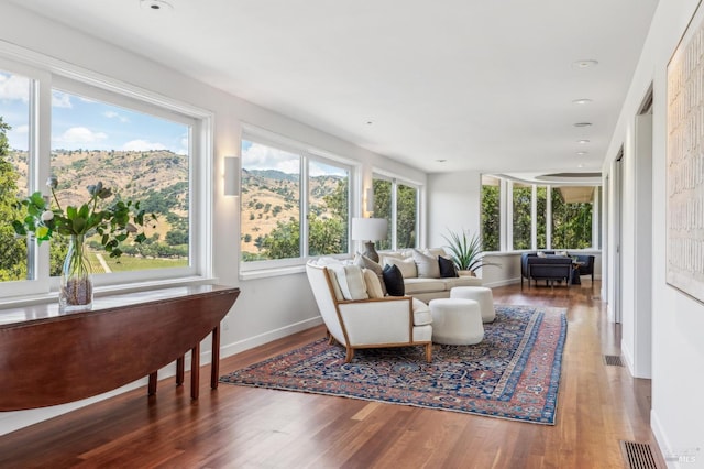 5768 Silverado Trl, Napa, CA 94558 - sunroom / solarium featuring wood finished floors, a mountain view, baseboards, and recessed lighting