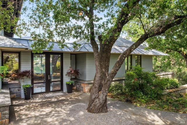 5768 Silverado Trl, Napa, CA 94558 - view of front of house featuring metal roof, french doors, and a standing seam roof