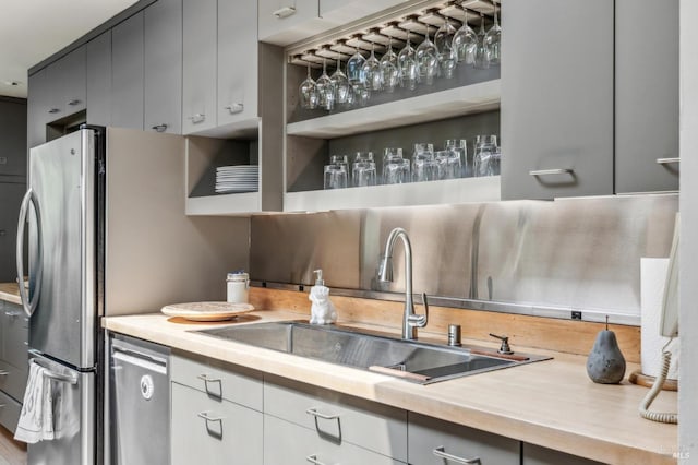 5768 Silverado Trl, Napa, CA 94558 - kitchen featuring a sink, stainless steel dishwasher, light countertops, and gray cabinetry