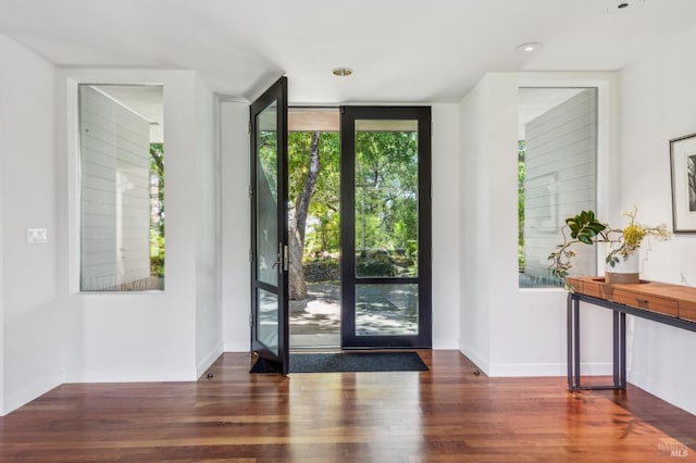 5768 Silverado Trl, Napa, CA 94558 - entryway with wood finished floors, expansive windows, and baseboards
