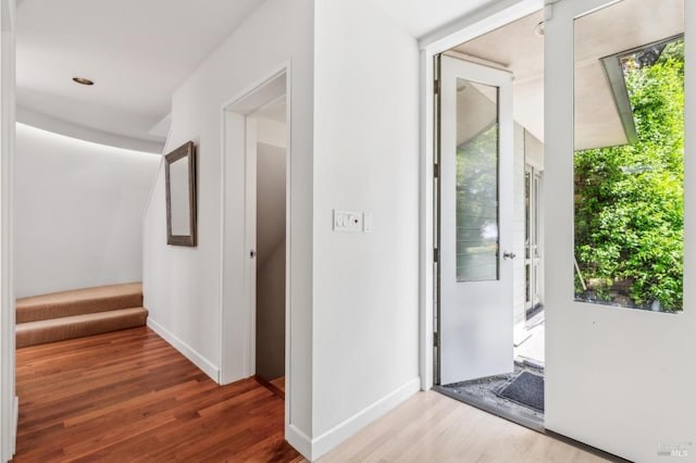 5768 Silverado Trl, Napa, CA 94558 - hall with wood finished floors, stairway, and baseboards