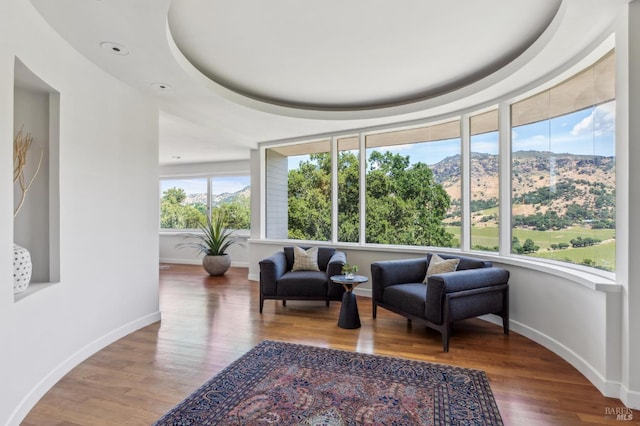 5768 Silverado Trl, Napa, CA 94558 - living area with a mountain view, wood finished floors, and baseboards