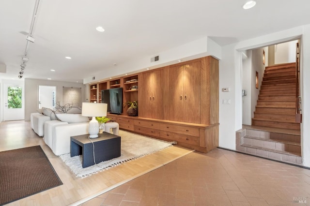 5768 Silverado Trl, Napa, CA 94558 - living area with track lighting, stairs, and recessed lighting