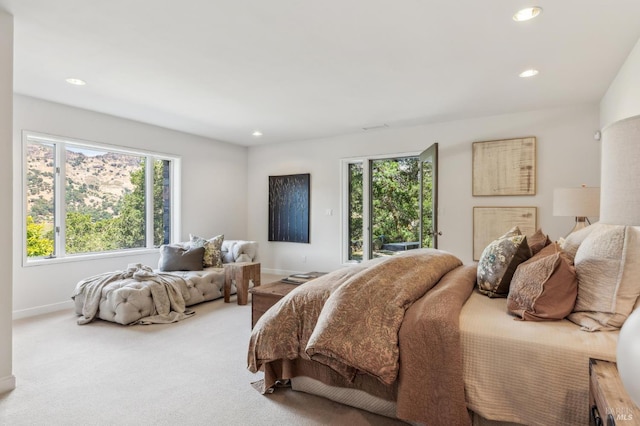5768 Silverado Trl, Napa, CA 94558 - bedroom with multiple windows, recessed lighting, baseboards, carpet floors, and access to exterior