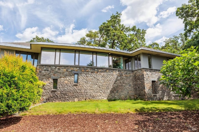 5768 Silverado Trl, Napa, CA 94558 - rear view of property with stone siding and a yard