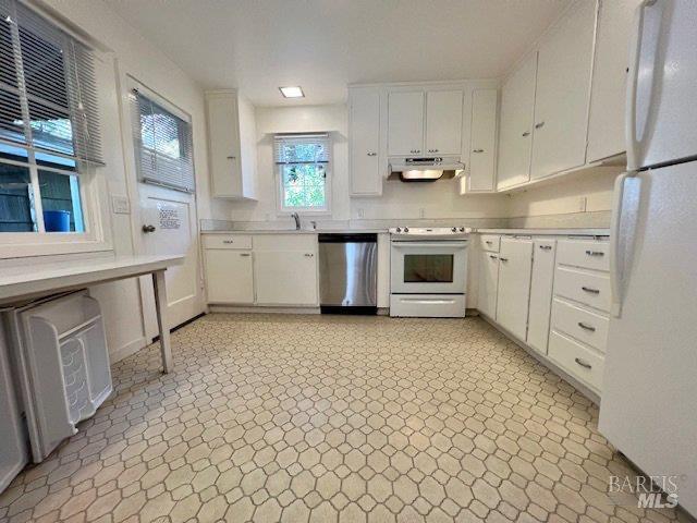 121 W Blithedale Ave, Mill Valley, CA 94941 - kitchen featuring white appliances, under cabinet range hood, white cabinetry, and light countertops