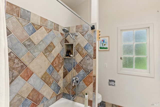 121 W Blithedale Ave, Mill Valley, CA 94941 - bathroom with washtub / shower combination, toilet, stone finish flooring, and baseboards