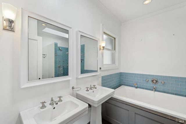 616 Locust St, Sausalito, CA 94965 - bathroom with ornamental molding, a garden tub, a shower stall, and two sinks