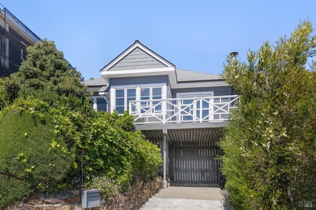 616 Locust St, Sausalito, CA 94965 - rear view of house featuring a gate, a carport, roof with shingles, and concrete driveway