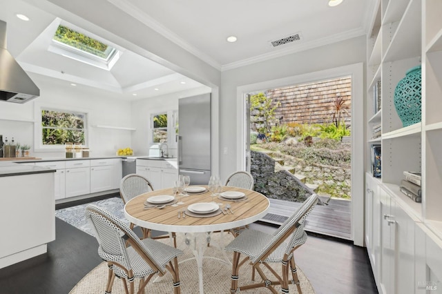 616 Locust St, Sausalito, CA 94965 - dining space featuring a skylight, dark wood-style flooring, crown molding, and recessed lighting
