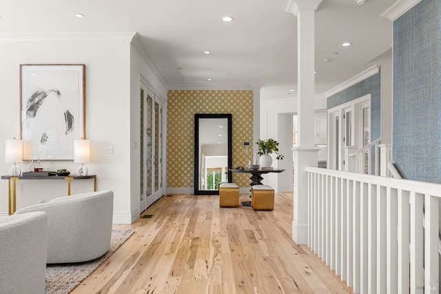 30 Sandy Ln, Mill Valley, CA 94941 - hallway featuring crown molding, light wood-style floors, decorative columns, wallpapered walls, and baseboards