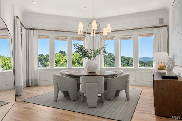 30 Sandy Ln, Mill Valley, CA 94941 - dining room featuring plenty of natural light, a decorative wall, light wood-style floors, a chandelier, and crown molding
