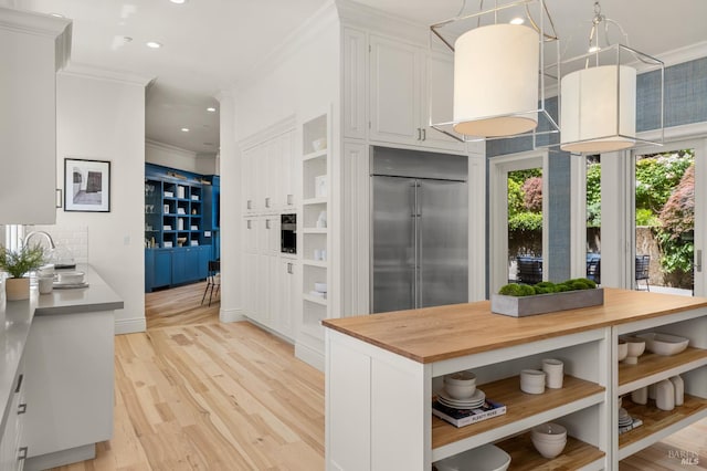 30 Sandy Ln, Mill Valley, CA 94941 - kitchen featuring open shelves, stainless steel built in refrigerator, butcher block countertops, crown molding, and white cabinets