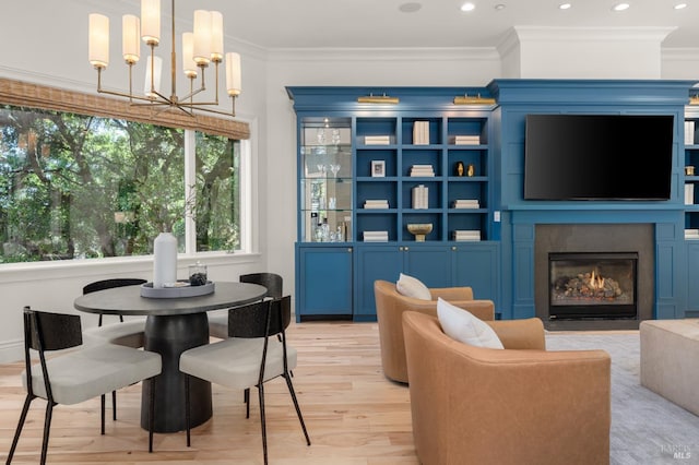 30 Sandy Ln, Mill Valley, CA 94941 - dining room with light wood finished floors, a chandelier, crown molding, a fireplace with flush hearth, and recessed lighting