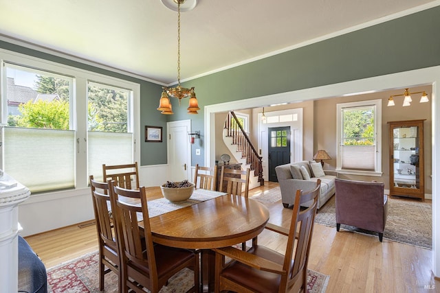 406 Franklin St, Napa, CA 94559 - dining room featuring stairway, light wood-style floors, a chandelier, and crown molding