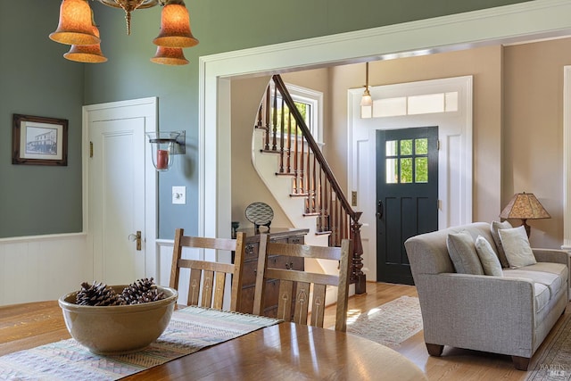 406 Franklin St, Napa, CA 94559 - entryway with light wood-type flooring, stairs, and wainscoting