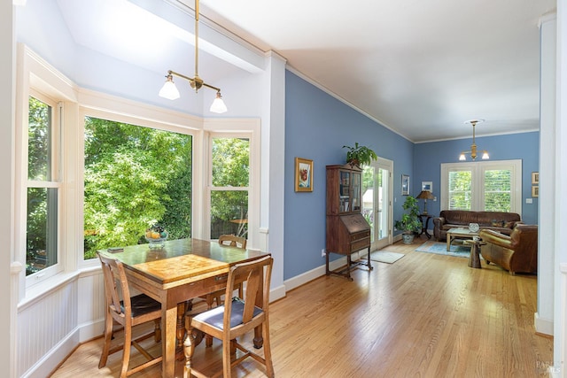 406 Franklin St, Napa, CA 94559 - dining room featuring a chandelier, light wood-style floors, crown molding, and baseboards