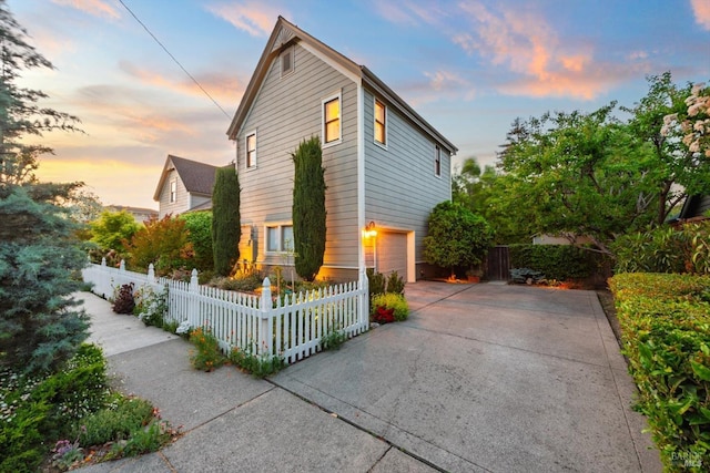 406 Franklin St, Napa, CA 94559 - view of front of house with concrete driveway, an attached garage, and a fenced front yard