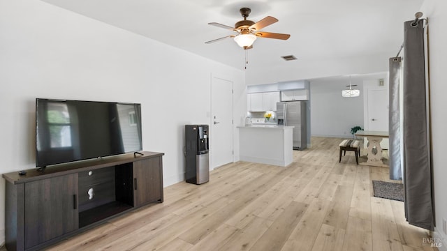 265 Chestnut St, Dixon, CA 95620 - living area with light wood-type flooring, ceiling fan, and baseboards