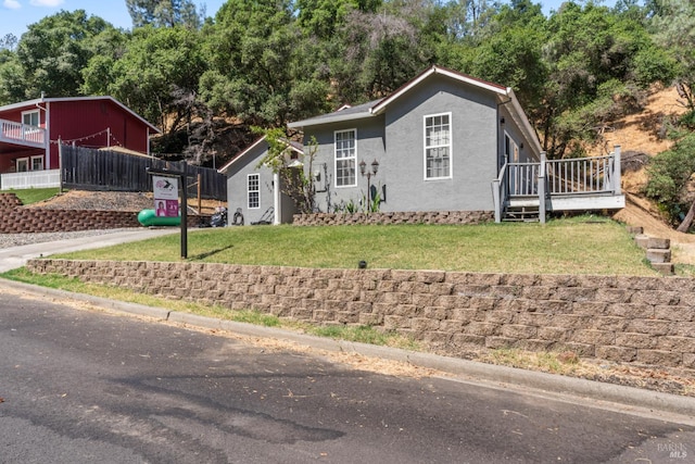 1017 Arroyo Linda Ct, Napa, CA 94558 - view of front of home with a wooden deck, stucco siding, and view of scattered trees