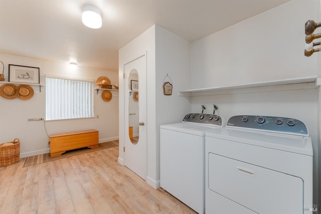 1961 Foothill Dr, Redwood Valley, CA 95470 - laundry room with independent washer and dryer, light wood-type flooring, and baseboards