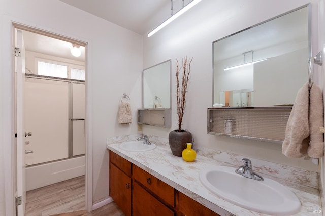 1961 Foothill Dr, Redwood Valley, CA 95470 - bathroom with wood finished floors, double vanity, and bath / shower combo with glass door