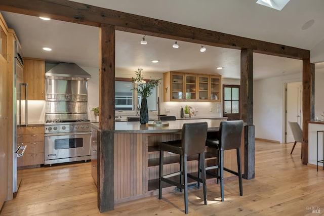 260 Geysers Rd, Cloverdale, CA 95425 - kitchen featuring high end appliances, beamed ceiling, glass insert cabinets, light wood-type flooring, and recessed lighting