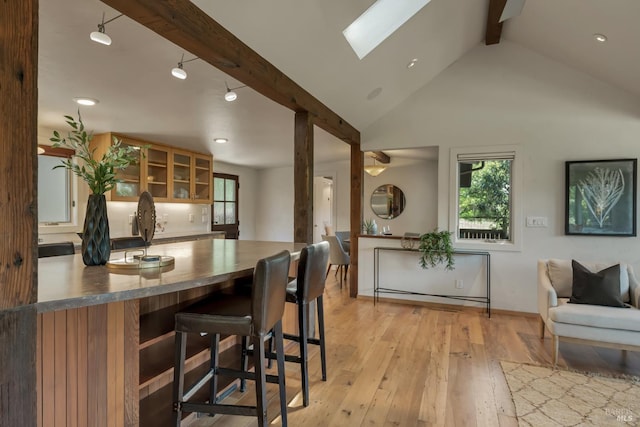 260 Geysers Rd, Cloverdale, CA 95425 - dining area featuring beamed ceiling, a skylight, light wood-style floors, recessed lighting, and baseboards