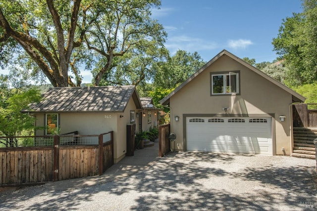 260 Geysers Rd, Cloverdale, CA 95425 - view of front of property featuring stucco siding, driveway, and a standing seam roof