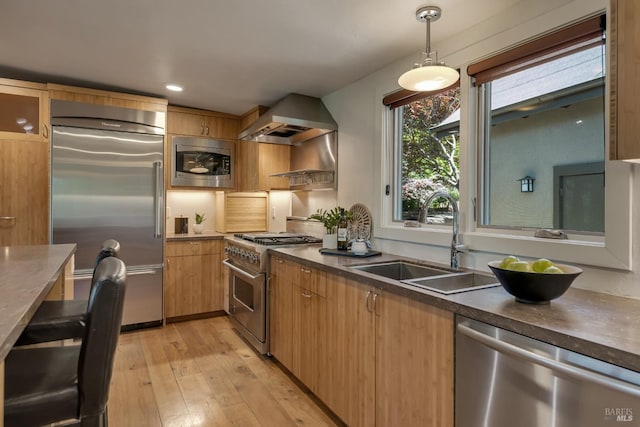 260 Geysers Rd, Cloverdale, CA 95425 - kitchen with built in appliances, wall chimney exhaust hood, a sink, light wood finished floors, and dark countertops