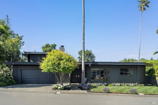 1 Rosebank Ln, Kentfield, CA 94904 - mid-century home with concrete driveway and a chimney