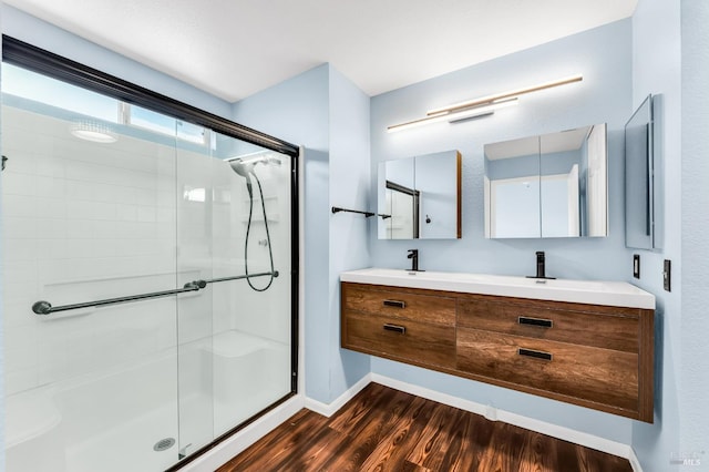 247 Clearpointe Dr, Vallejo, CA 94591 - full bathroom with a shower stall, wood finished floors, double vanity, and baseboards