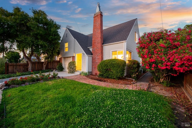 1186 E Ave, Napa, CA 94559 - view of front of property with a garage, a chimney, and roof with shingles