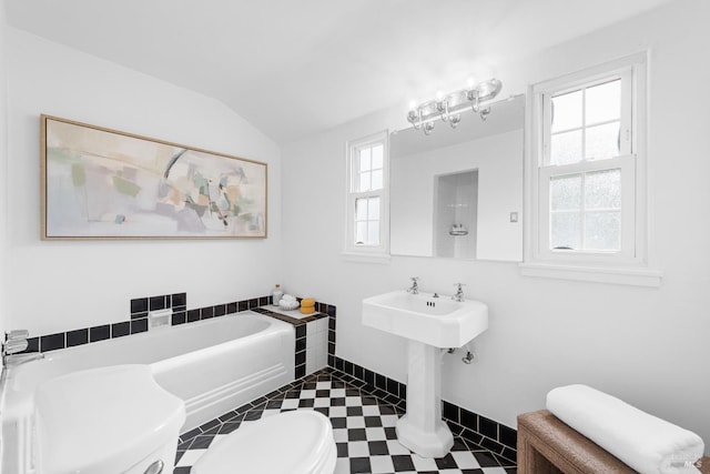 1186 E Ave, Napa, CA 94559 - full bathroom with toilet, a bath, lofted ceiling, baseboards, and a sink