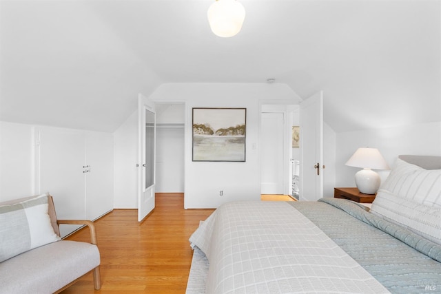1186 E Ave, Napa, CA 94559 - bedroom featuring lofted ceiling, light wood-type flooring, a closet, and a walk in closet