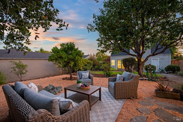 1186 E Ave, Napa, CA 94559 - patio terrace at dusk featuring an outdoor living space, a patio area, and an outdoor structure