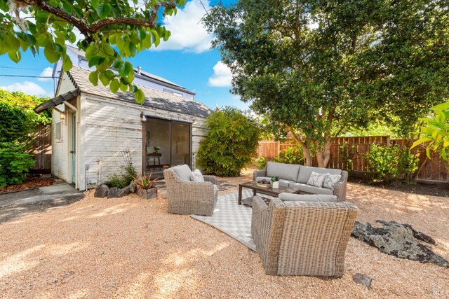 1186 E Ave, Napa, CA 94559 - fenced backyard with an outdoor living space, an outbuilding, and a patio
