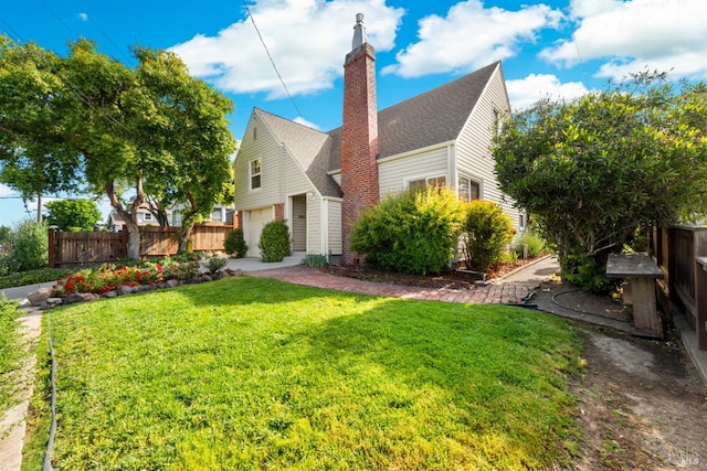 1186 E Ave, Napa, CA 94559 - view of side of property featuring a chimney, a shingled roof, and an attached garage