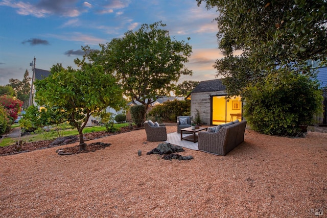 1186 E Ave, Napa, CA 94559 - yard at dusk with an outdoor living space, a patio area, and an outbuilding