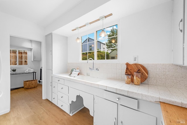 1186 E Ave, Napa, CA 94559 - bathroom with a sink, wood finished floors, and tasteful backsplash