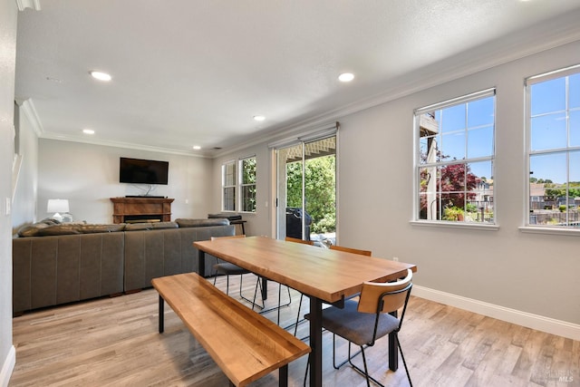 712 Tahoe Ct, Fairfield, CA 94534 - dining area featuring crown molding, light wood-style flooring, baseboards, a fireplace, and recessed lighting