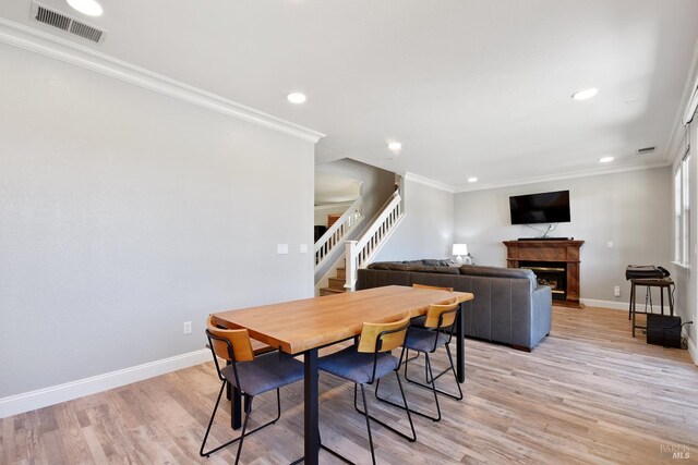 712 Tahoe Ct, Fairfield, CA 94534 - dining space with stairway, crown molding, recessed lighting, baseboards, and light wood-style flooring