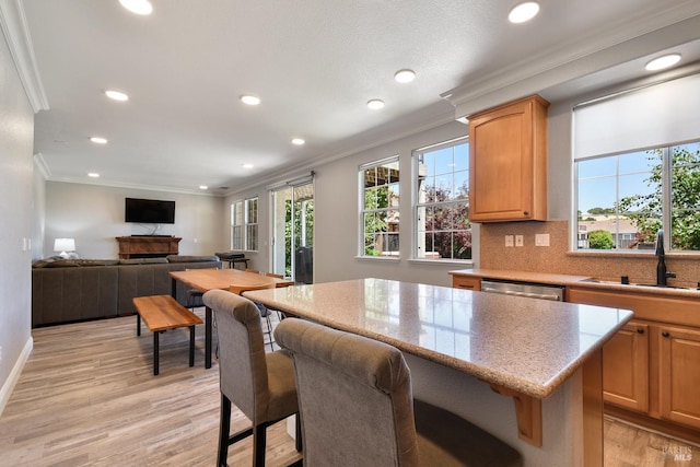 712 Tahoe Ct, Fairfield, CA 94534 - kitchen with a sink, crown molding, plenty of natural light, light wood-type flooring, and recessed lighting