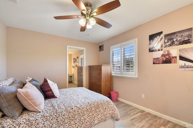 712 Tahoe Ct, Fairfield, CA 94534 - bedroom with light wood finished floors, baseboards, ensuite bathroom, and a ceiling fan
