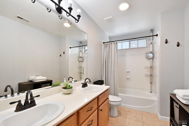 712 Tahoe Ct, Fairfield, CA 94534 - full bathroom featuring toilet, double vanity, shower / bath combo with shower curtain, and tile patterned flooring