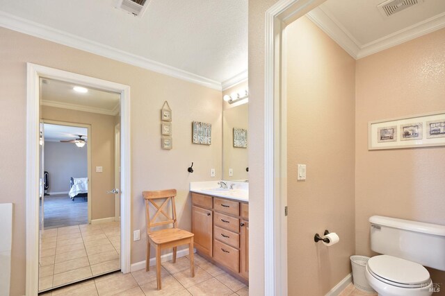 712 Tahoe Ct, Fairfield, CA 94534 - bathroom with ornamental molding, vanity, tile patterned flooring, connected bathroom, and toilet