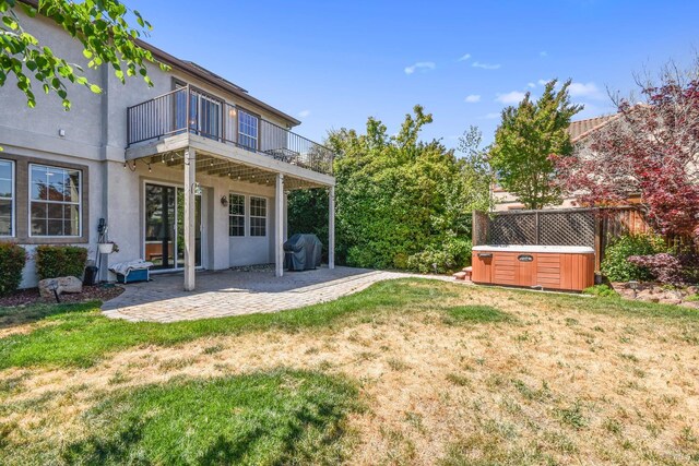 712 Tahoe Ct, Fairfield, CA 94534 - view of green lawn featuring a hot tub, a patio area, and a balcony